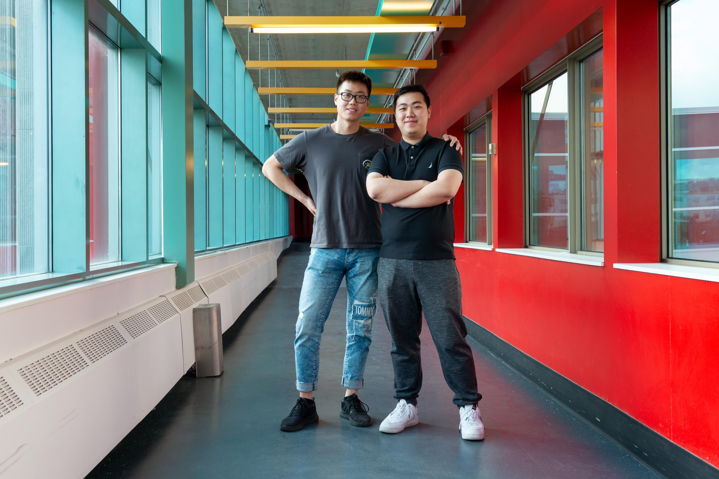 two students standing in indoor bridge
