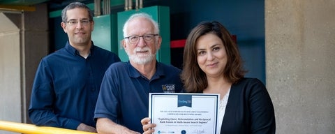 Besat Kassaie, Andrew Kane and Frank Tompa holding best paper award certificate