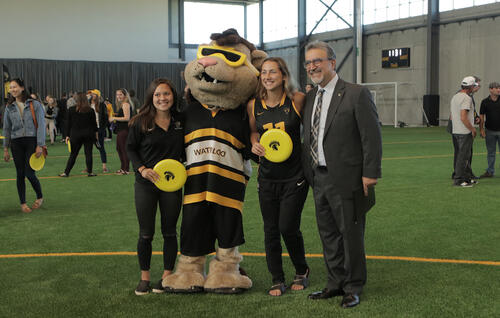 Feridun at field house grand opening with students