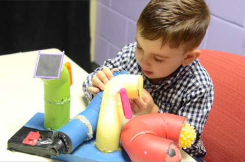 Young boy playing with toy