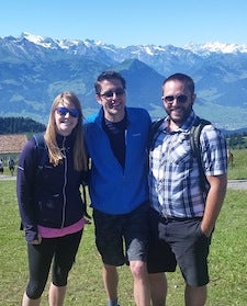 Angie Lang, Clark Dickerson, and Alan Cudlip in front of the Swiss Alps. 