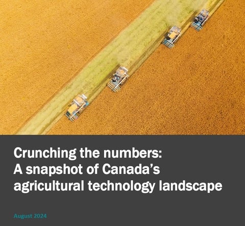 Tractors moving across a crop field