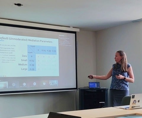 Hilary Bergsieker presenting an invited talk at UCLouvain