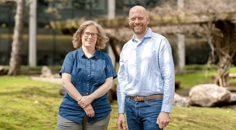 Jen Parks and Josh Neufeld standing in the rock garden. 