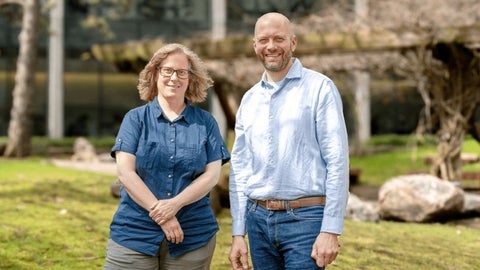 Jen Parks and Josh Neufeld standing in the rock garden. 