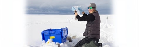 Jenine McCutcheon sampling snow on the Greenland Ice Sheet