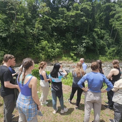 Dean Chris Hauser instructs students in the field on a trip to Costa Rica. 
