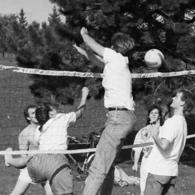 Students playing volleyball. 