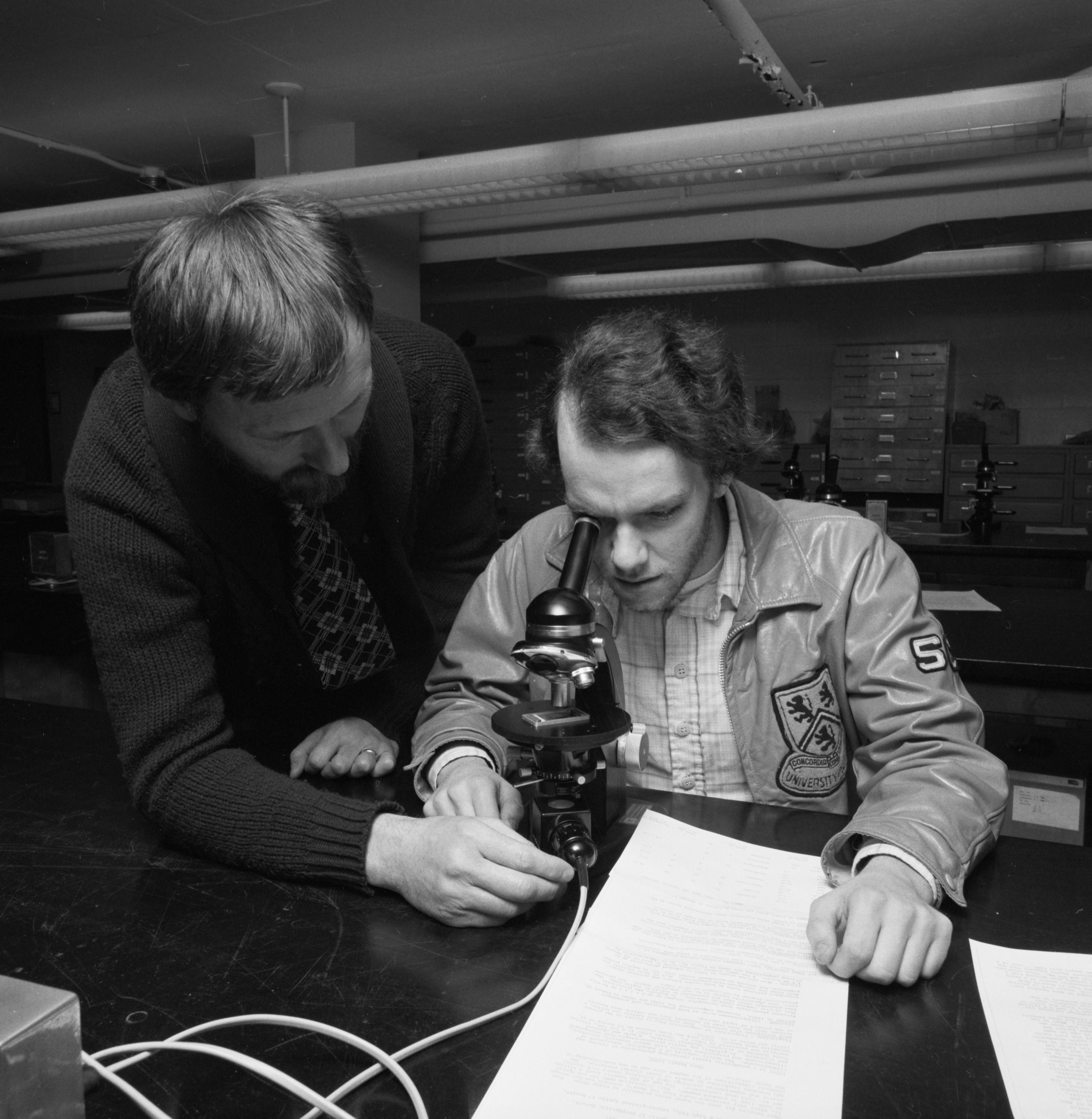 Professor and student in lab. 