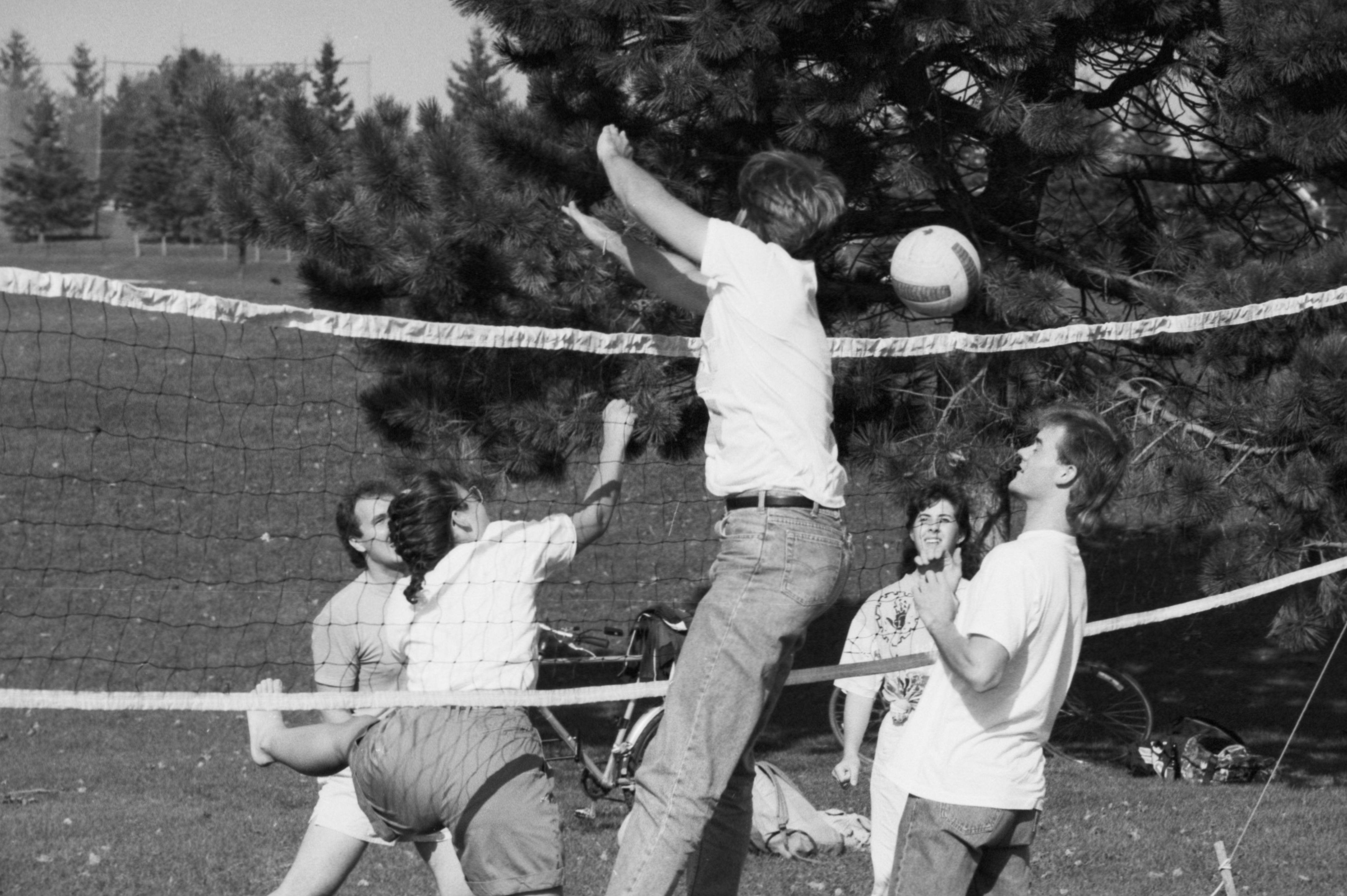 Students playing volleyball. 