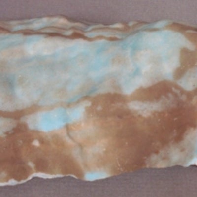Aragonite; prodominately auburn with white and light blue accents