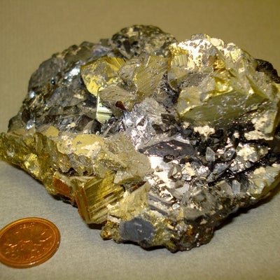 Calcite, Galena, Chalcopyrite, Sphalerite, Quartz and Pyrite next to a penny for size comparison