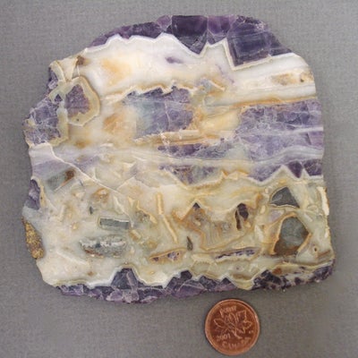 Quartz and Fluorite Slab next to a penny for size comparison