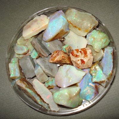 many different pieces of Opal in a small dish