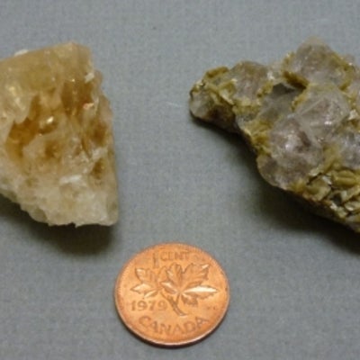 Fluorite next to a penny for size comparison