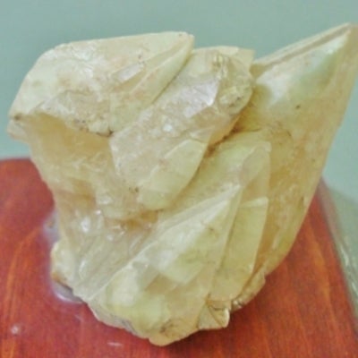 Calcite mounted on a wood base