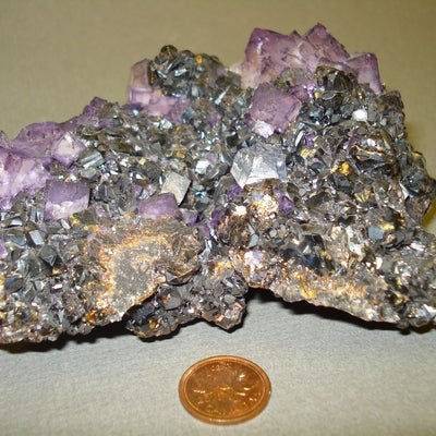 Fluorite, Galena and Sphalenite next to a penny for size comparison