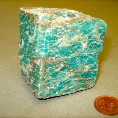 Cube-like block of vibrant green mineral