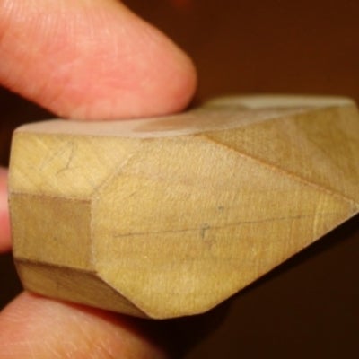 close-up of the wooden shape showing three prisms and two pinacoids