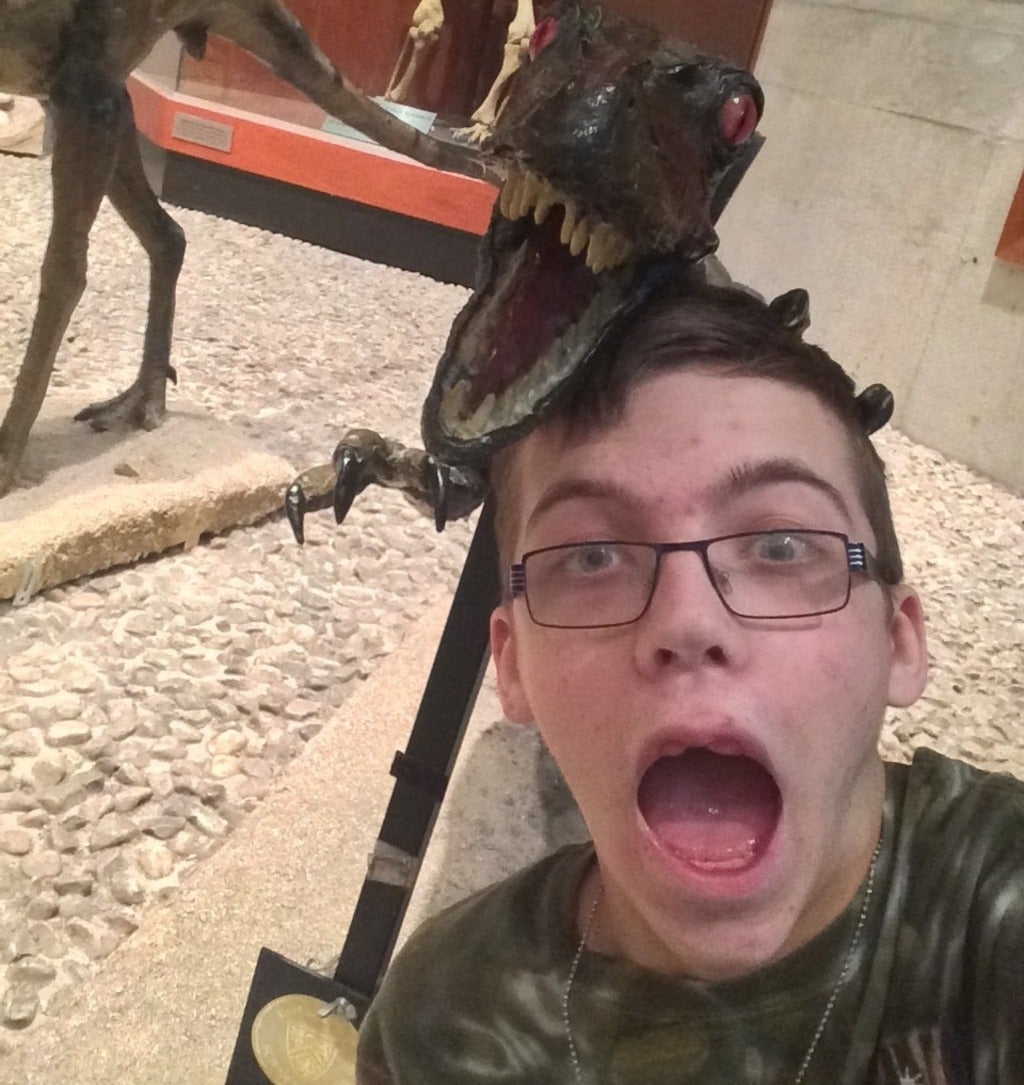 Jacob trembling beside the velociraptor 