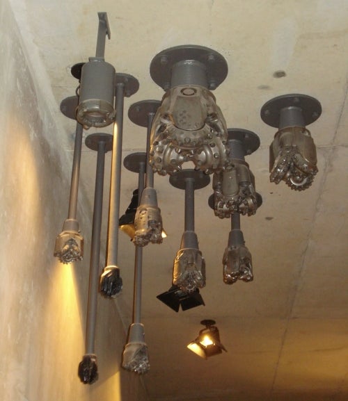 brown metal drill bits hanging from ceiling