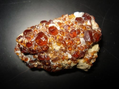red garnet crystals in white rock