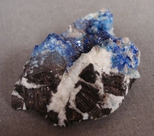 blue crystals in black and white rock