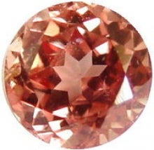 orange-red round gemstone; Padparadscha Sapphire
