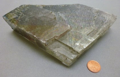 chalcopyrite next to a penny for size comparison