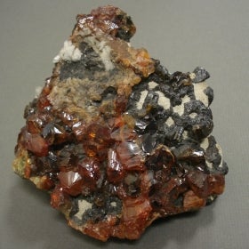 Sphalerite; mostly red and black in colour