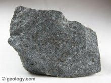 large grey specimen of emery corundum that ressembles a rock