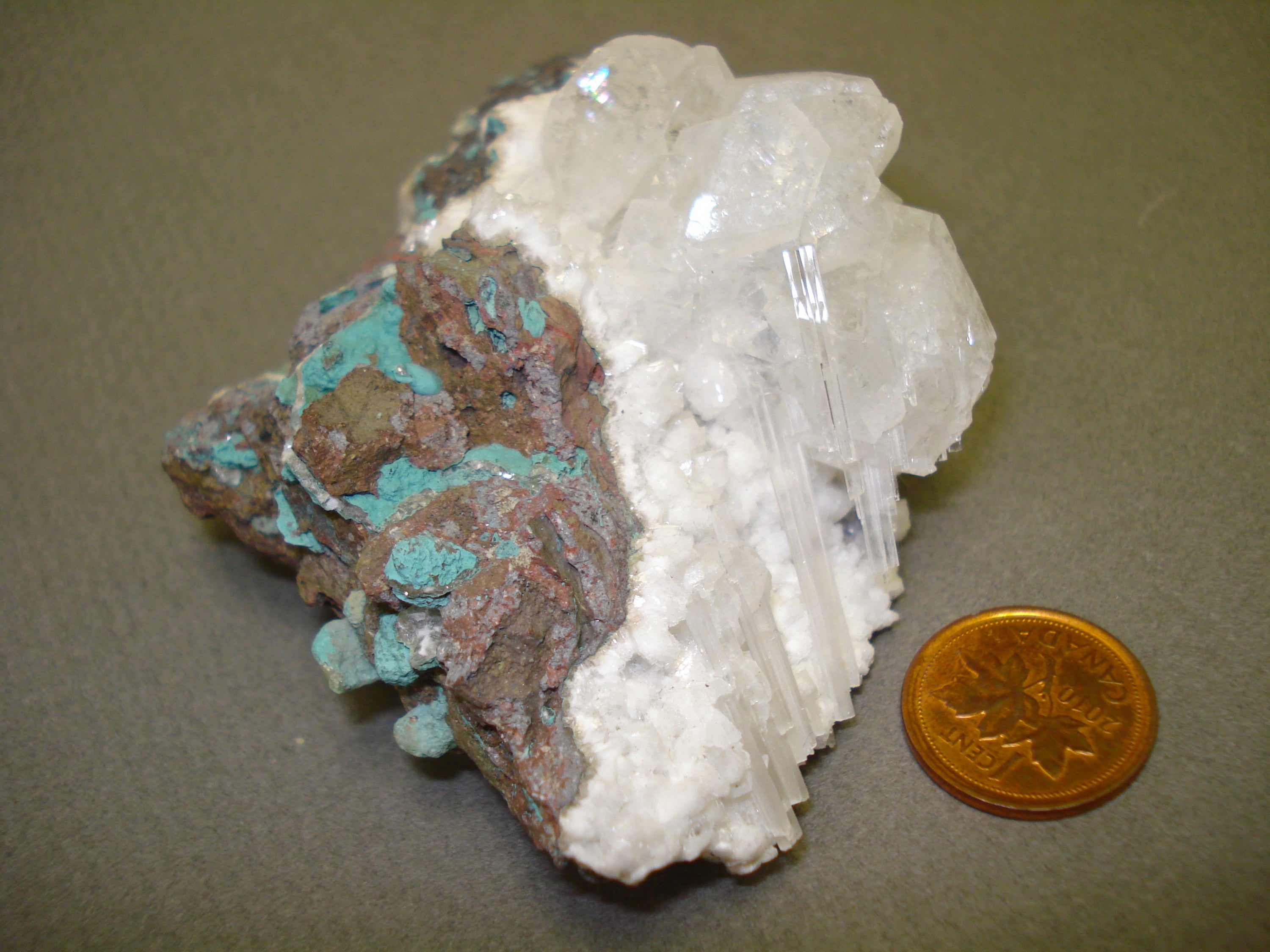 Apophyllite and Mesolite next to a penny for size comparison