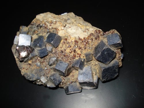 cubic galena crystals in brown rock