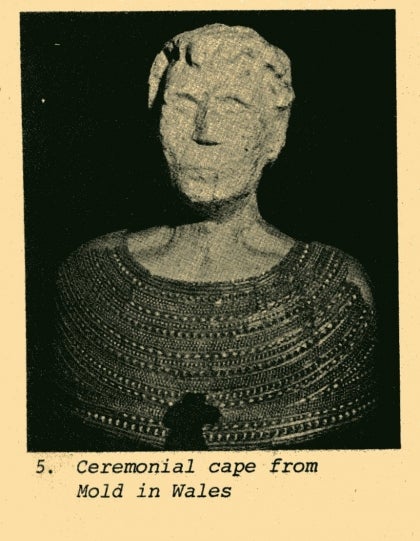 ceremonial cape made of gold from wales draped on a bust