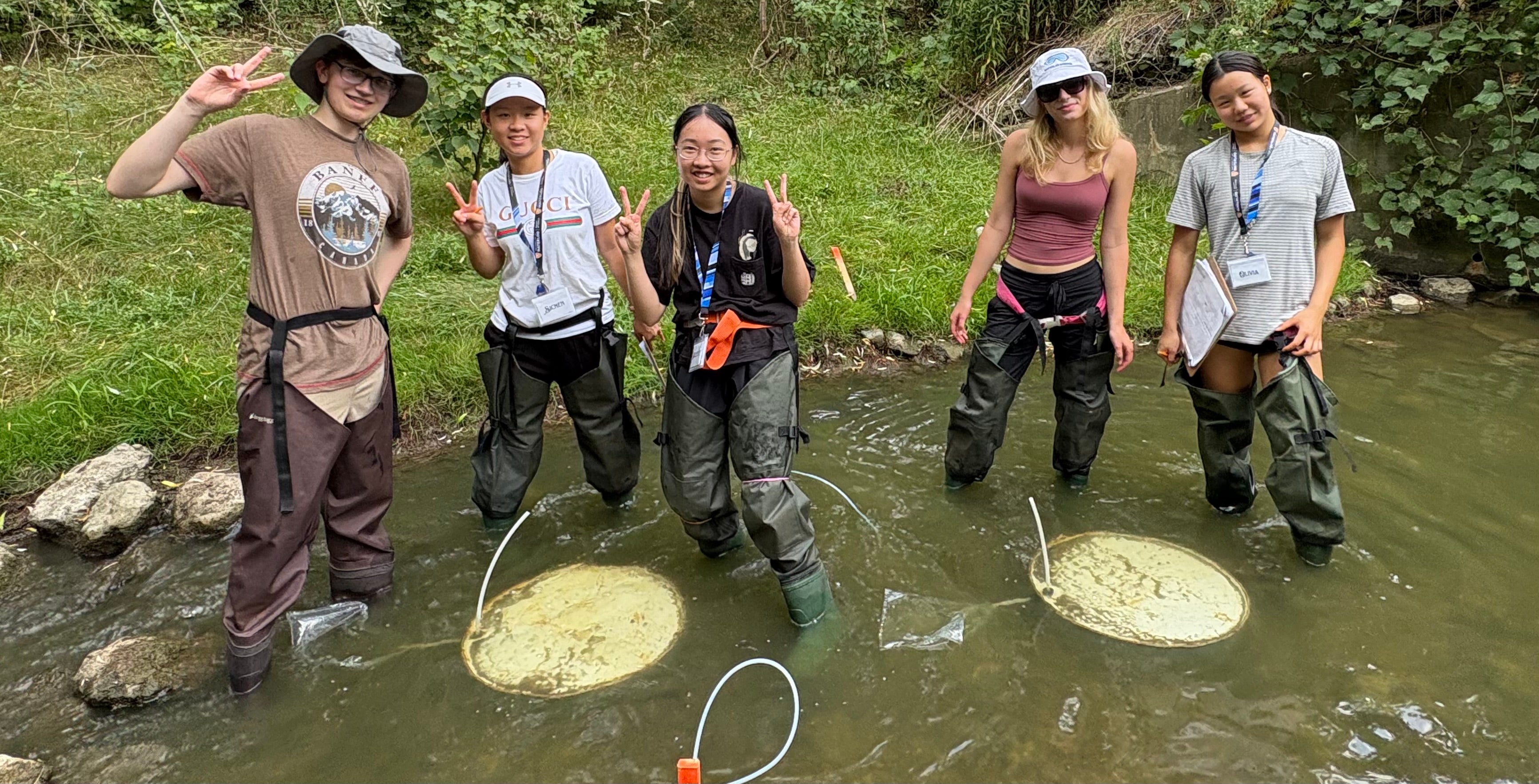 Secondary students installing seepage meters in Laurel creek.