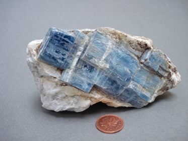 blue kyanite crystals in gray rock