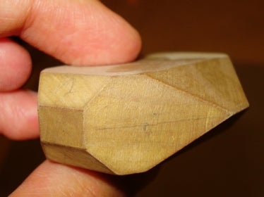 close-up of the wooden shape showing three prisms and two pinacoids