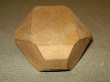 wooden shape showing three prisms and two pinacoids