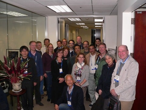 Hans Dürr among a group of meeting participants. 