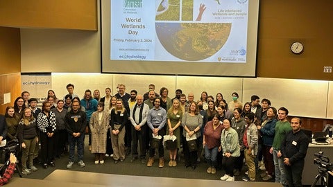 World Wetlands Day 2024 participants. Large group photo in front of the World Wetlands Day themed slide.