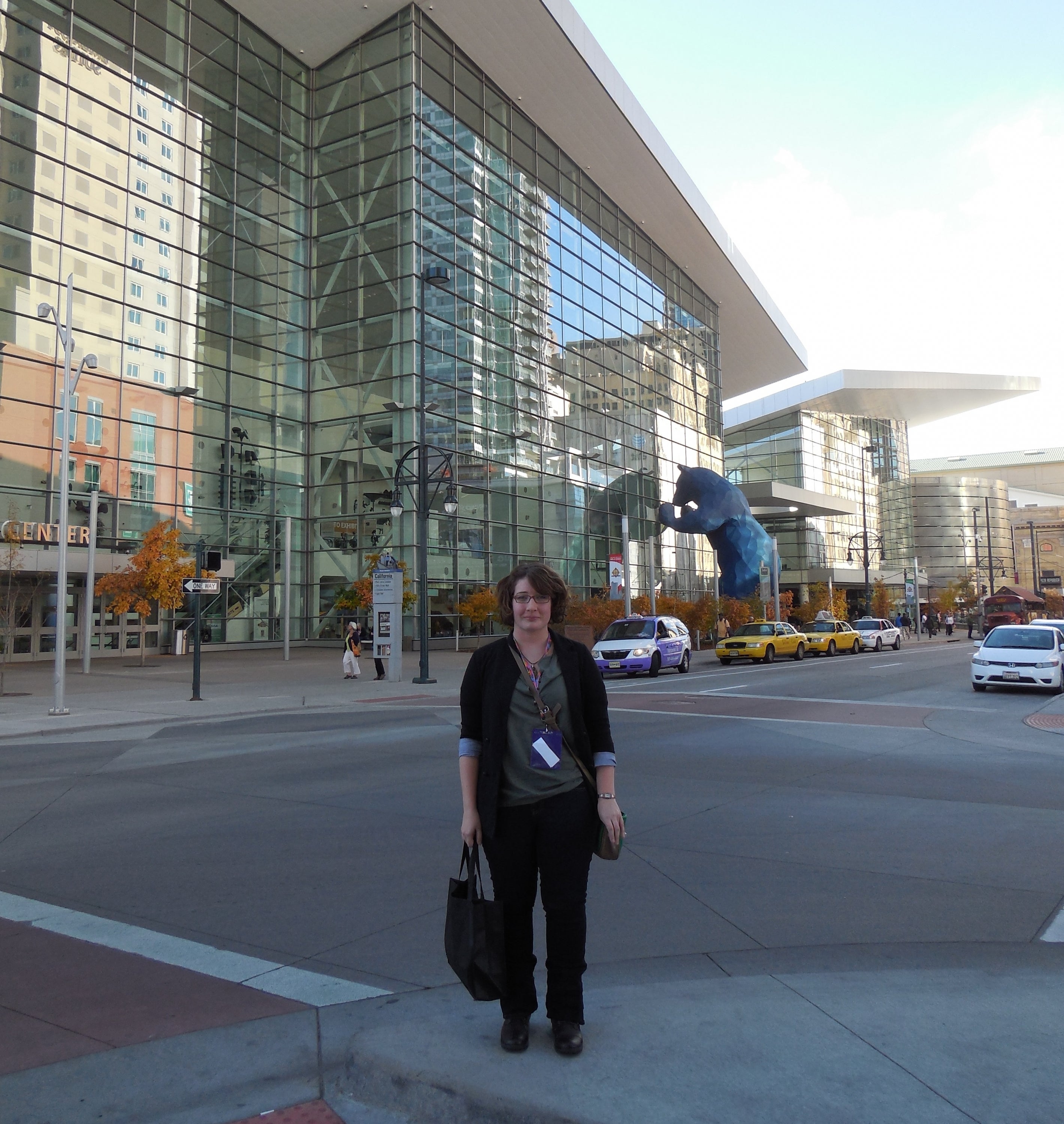 Amanda Niederkorn standing in front of the Denver Convention Centre.