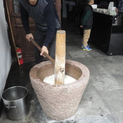 Traditional way of making sticky rice cake.