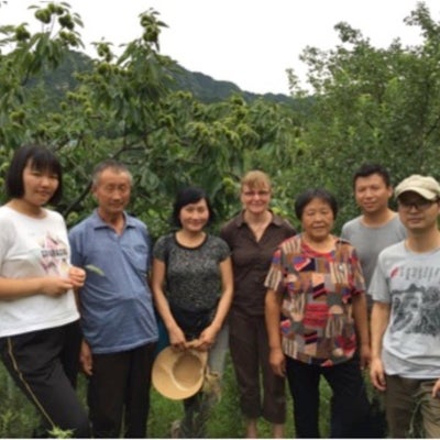Steffanie Scott and Zhenzhong Si with farmers from Baoshi Village in Hebei province