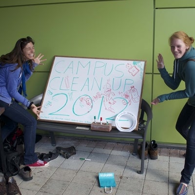 Students posing with sign