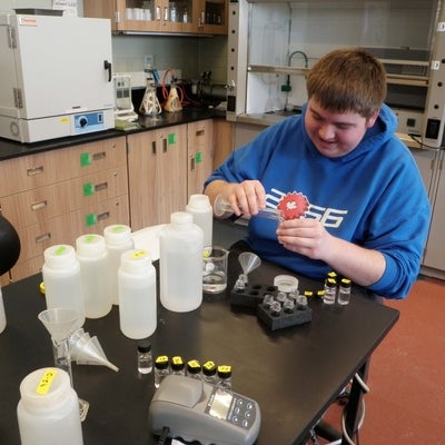 Student testing water samples