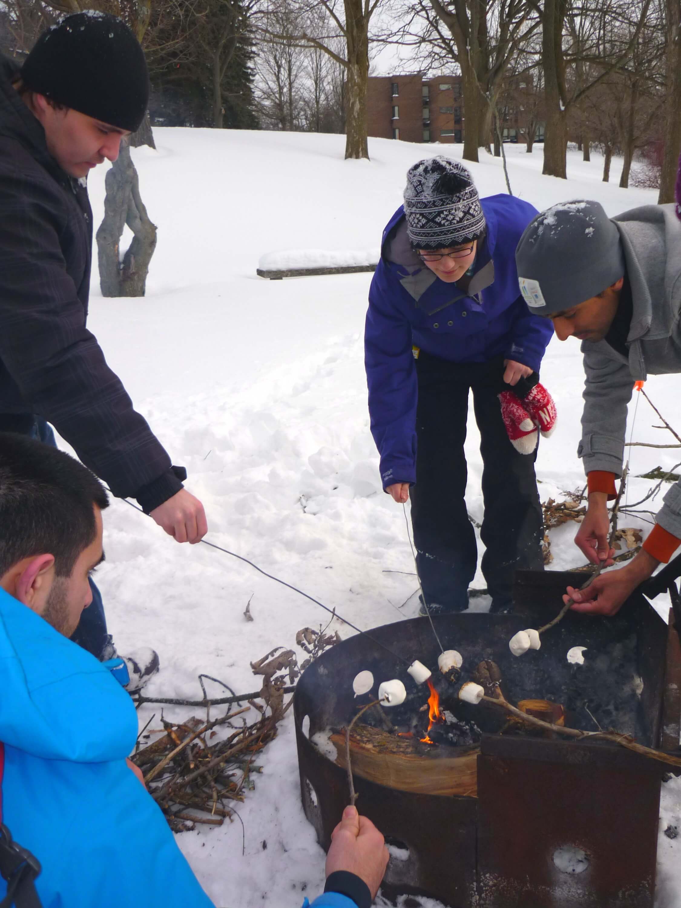 Students roasting marshmallows