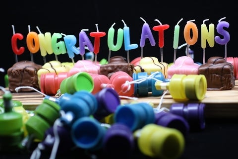 Candles spelling out "congratulations."