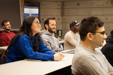 ECON grad students sitting in class