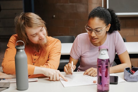 two ECON MA students working together