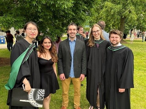Students and a professor at convocation
